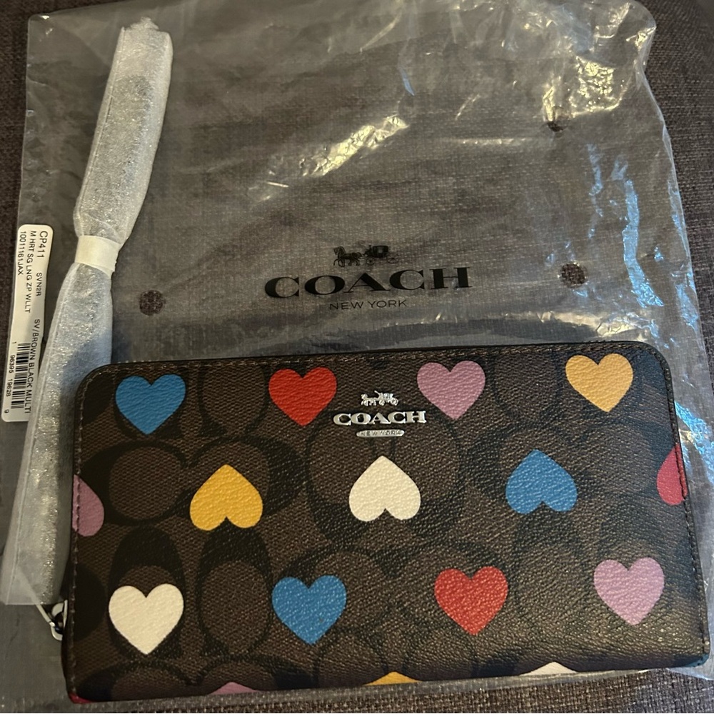 Like new!  COACH Long Zip Around Wallet In Signature Canvas With Heart Print